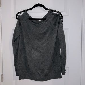 Garage sweater with sleeve criss cross detail